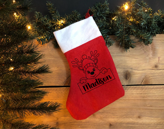 red personalised stocking with custom name applied to the Christmas stocking